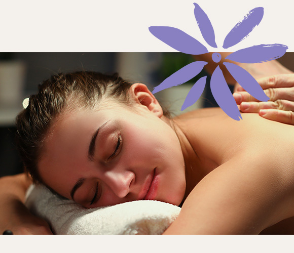 a smiling woman receiving a full body massage